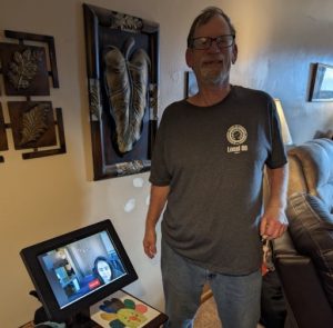 man standing with RM device