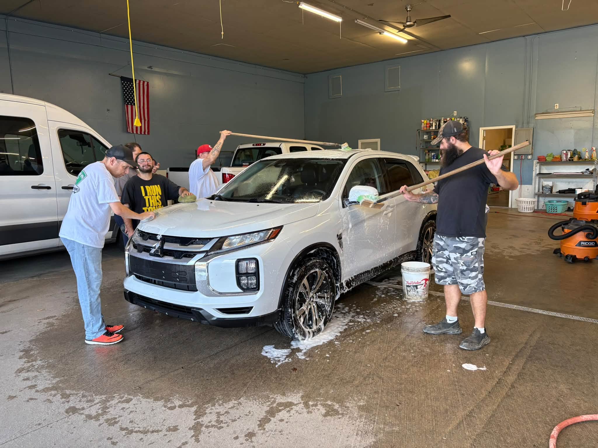 Threshold team washing a van
